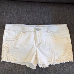 White jean shorts with lace detailing & distress